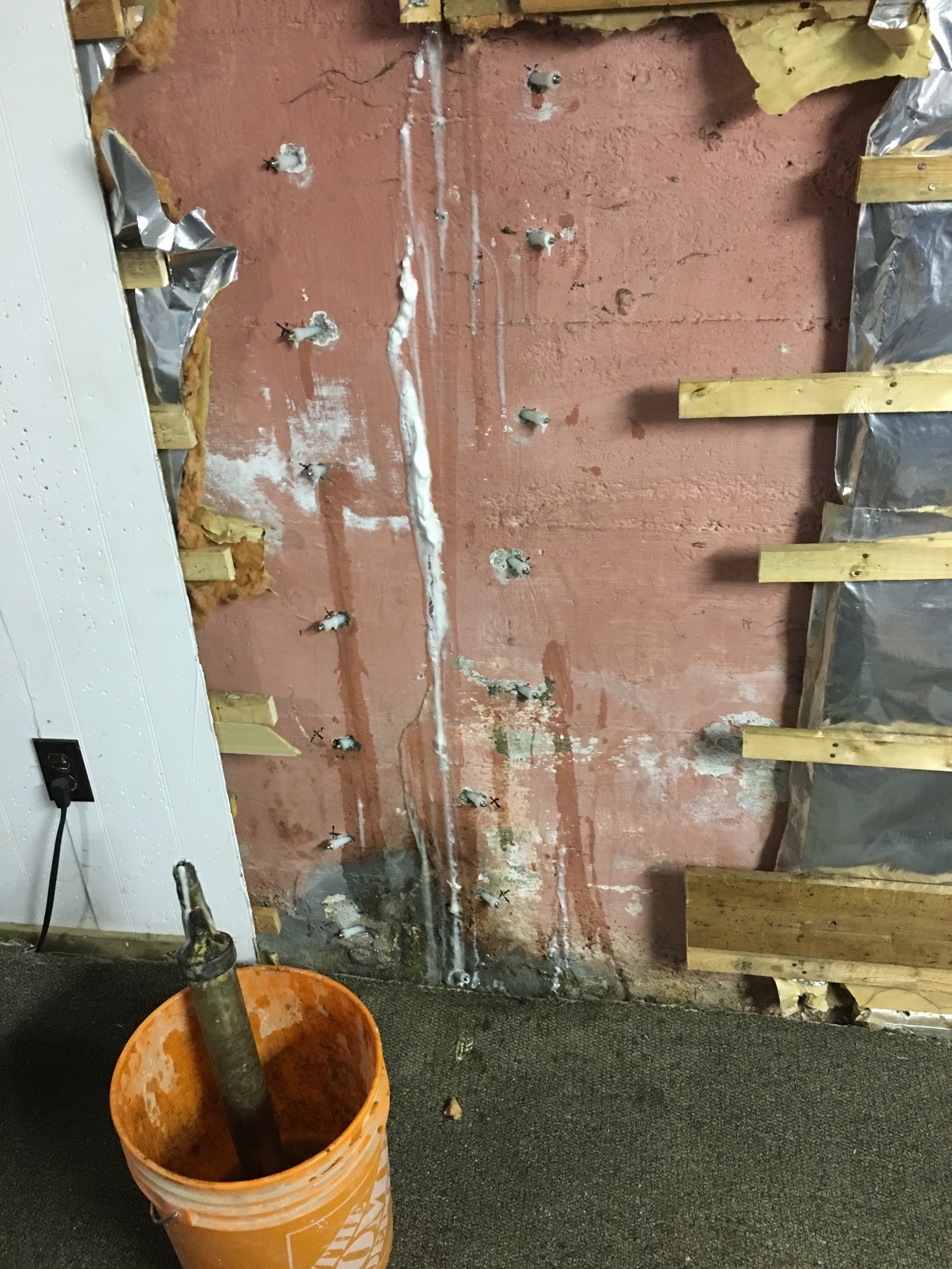 Foundation crack sealed with a row of high-pressure injection ports